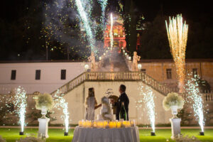 Italian Wedding elegant detail Villa Selvatico night cake setup flowers candles fireworks