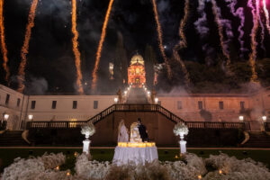 Italian Wedding elegant detail Villa Selvatico night cake setup flowers candles fireworks