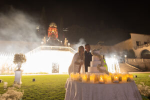 Italian Wedding elegant detail Villa Selvatico night cake setup flowers candles fireworks