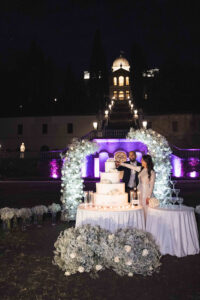 Italian Wedding Villa Selvatico elegant cake setup flower arch