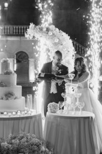 Italian Wedding Villa Selvatico elegant cake setup flower arch black and white